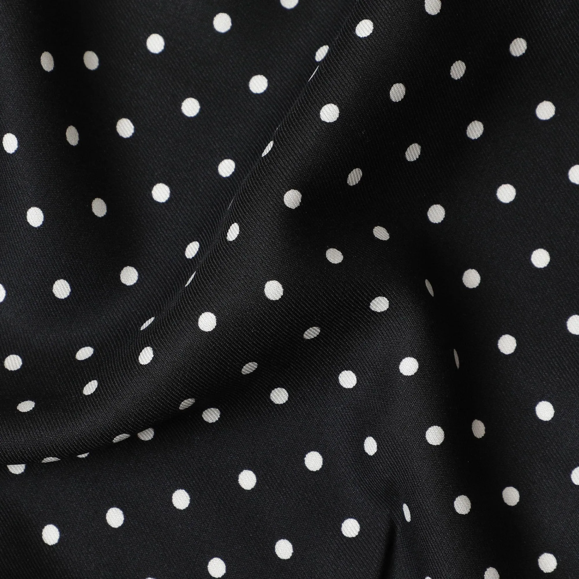Black viscose crepe printed fabric with white prints in polka dot design-D11157